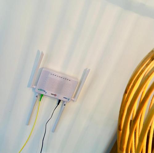 a small computer is plugged into a wall at Diamond Key Ahangama in Piyadigama