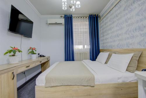 Postel nebo postele na pokoji v ubytování Viva Hotel