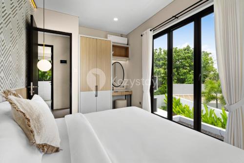 Ένα ή περισσότερα κρεβάτια σε δωμάτιο στο Marea Villa by Kozystay - Jimbaran