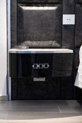 a black and white appliance in a room at Suite17 - Luxury GuestHouse in Giovinazzo