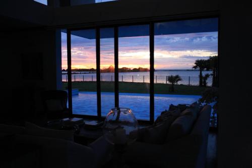 a room with a window with a view of the water at Villa Santé by The Serendipity Collection in Kalpitiya