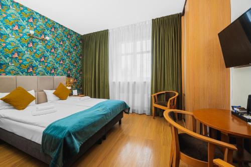 Postel nebo postele na pokoji v ubytování Perła Sudetów by Stay inn Hotels