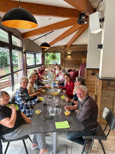 a group of people sitting at a long table at CIS-Ethic Etapes de Val Cenis in Lanslebourg-Mont-Cenis