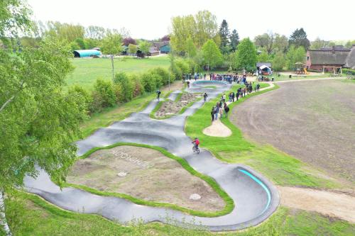 a group of people standing around a skate park at Ferienhof Lucht in Mühbrook