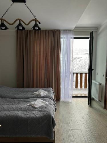 Postel nebo postele na pokoji v ubytování Mount Cottages Bakuriani