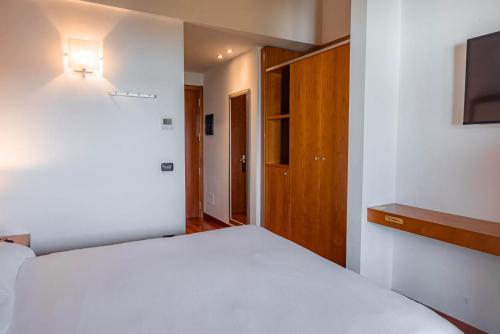 Postel nebo postele na pokoji v ubytování Hotel Mavino