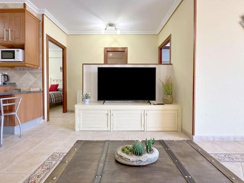 a living room with a large flat screen tv at Apartamento en centro de Laredo in Laredo