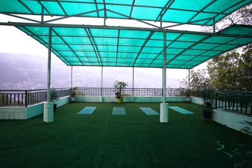 a view from the top of a building with a blue roof at Treenz Hotel in Gangtok