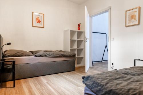 a bedroom with a bed and an open door at Kleines zentrales Apartment in Goch - Netflix in Goch