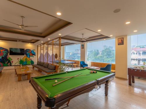 a living room with a pool table in it at Moustache Rishikesh Luxuria in Rishīkesh