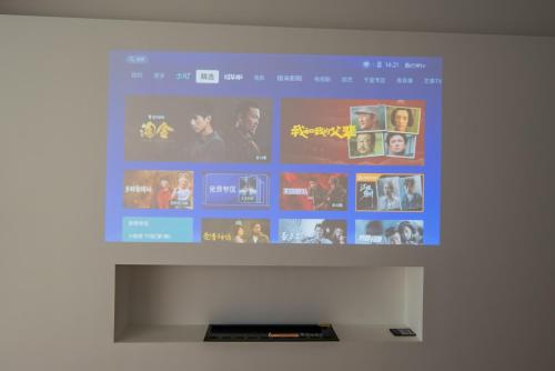 a television screen with a bunch of movies on it at Tonight Homestay South Shanxi Road Shanghai in Shanghai