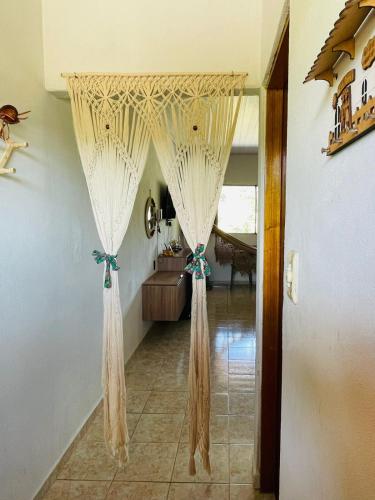 a hallway with a curtain in a room at Apt Flat 225 Condomínio Pedra do Rodeadouro in Bonito