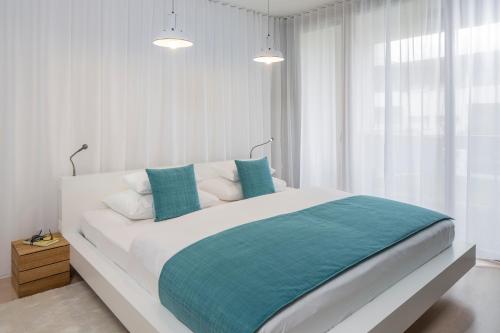 Postel nebo postele na pokoji v ubytování Apartments Spa Resort Styria- ADULTS ONLY