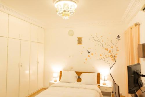 Résidence alphadis tesisinde bir odada yatak veya yataklar