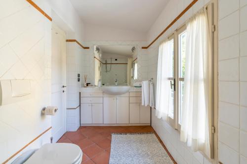 a bathroom with a toilet and a sink at Private Jacuzzi - Villa Bellosguardo in Florence Historic Center in Florence