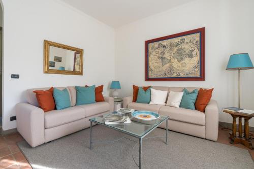 a living room with two couches and a table at Private Jacuzzi - Villa Bellosguardo in Florence Historic Center in Florence
