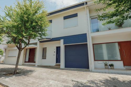 an image of a house with a garage at Blue Villa by Hosty in Porto