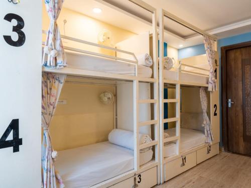 a group of bunk beds in a room at Moustache Rishikesh Luxuria in Rishīkesh