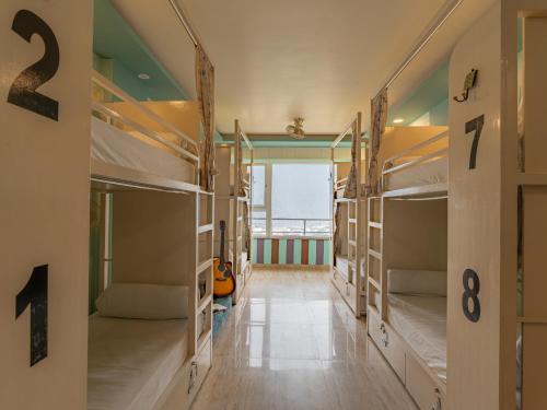 a hallway with bunk beds in a hostel at Moustache Rishikesh Luxuria in Rishīkesh