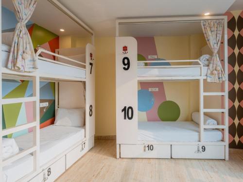 two bunk beds in a childrens room at Moustache Rishikesh Luxuria in Rishīkesh