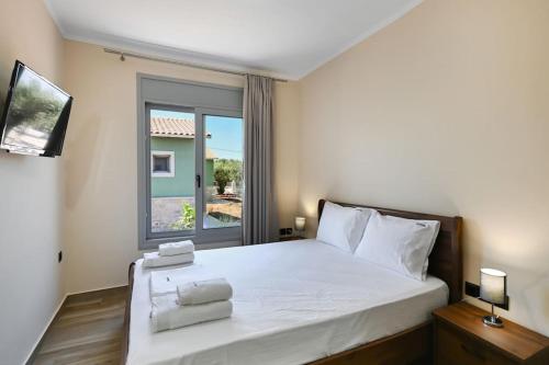 En eller flere senge i et værelse på Cosy Halipoma-Tilemahos into Lefkada town close