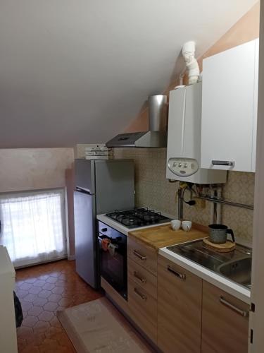 Kuchyň nebo kuchyňský kout v ubytování Garda City Home Family Apartments