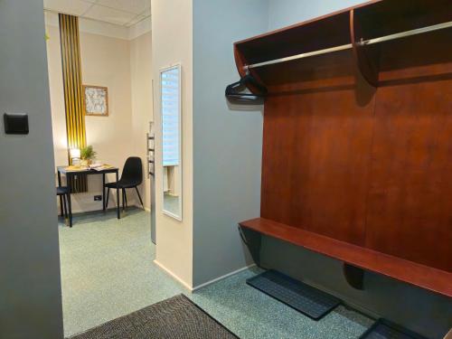 an office with a large wooden door and a desk at Heart of Old Riga 3 Bedroom Apartment by Dome Square in Rīga