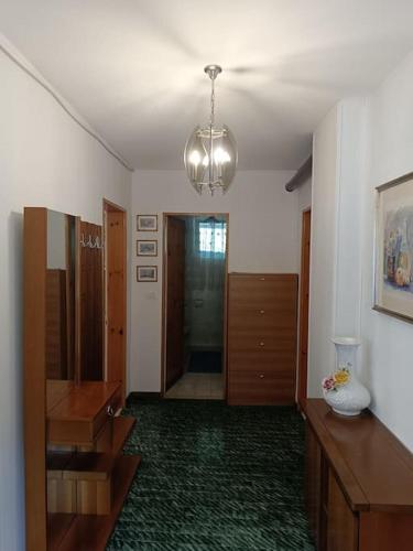 a room with a hallway with a dresser and a mirror at La Rotonda in Lastebasse