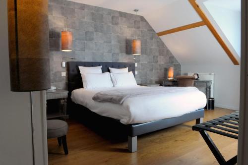 Postel nebo postele na pokoji v ubytování Hôtel d'Angleterre