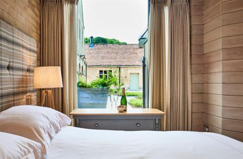 a bedroom with a bed and a window at Caspian House in Matfen