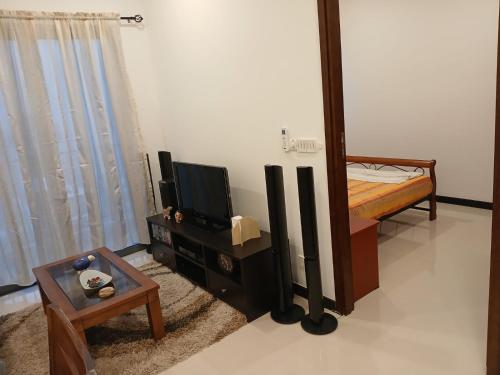 Televisyen dan/atau pusat hiburan di Tri-Zen Apartment, Tower 02, 38F, A5