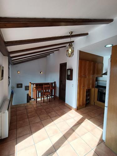 a kitchen and dining room with a table at El Balcón de la Sierra in Mora de Rubielos