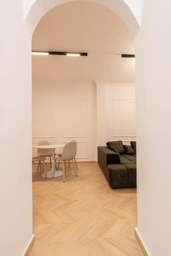 a living room with a couch and a table at Iris Luxury Apartment in Serres