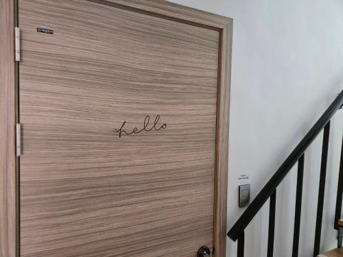 a wooden door with the word hello written on it at The Stay Christmas in Jeju