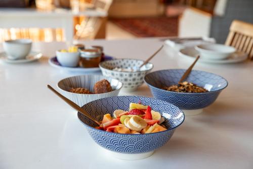 a table topped with bowls of food and nuts at Oudrif Farm in Clanwilliam