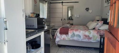 Kuchyň nebo kuchyňský kout v ubytování Coral Tree Guest Rooms