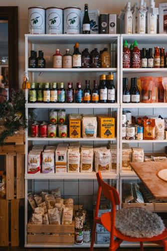 a refrigerator filled with lots of different types of food at Köpmans Boutique Hotel & Bistro in Höganäs