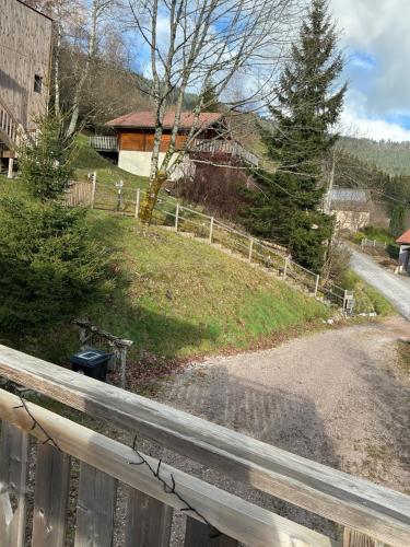 a view of a house from a fence at Gîte le Pieraline in Ventron