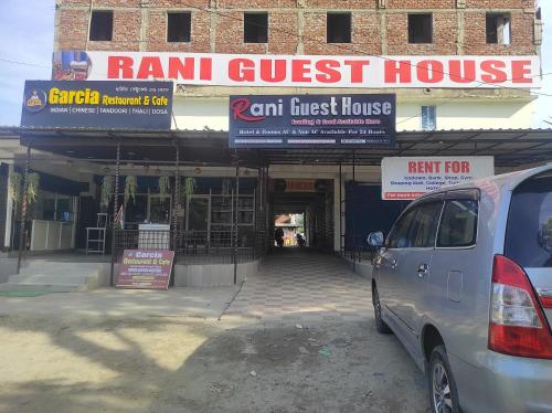 a van parked in front of a guest house at Rani Guest House in Gauhāti