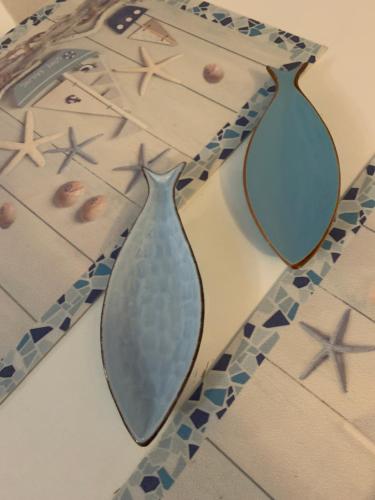 two vases are sitting on a table with mirrors at CASABARBARA lerici in Lerici