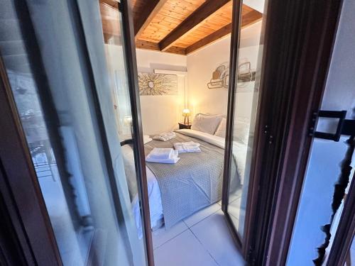 a view of a room with a bed and a window at Julie's Home in Kalavrita