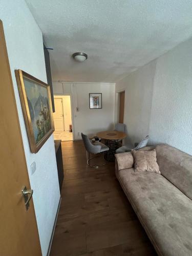 a living room with a couch and a table at Era Home in Murg