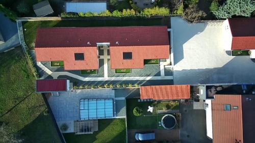 an overhead view of a building with red roofs at Résidence des Sables in Mably