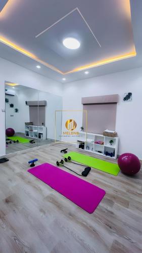 a room with a pink and green yoga mat at 5 bedroom terrace duplex in Wuse