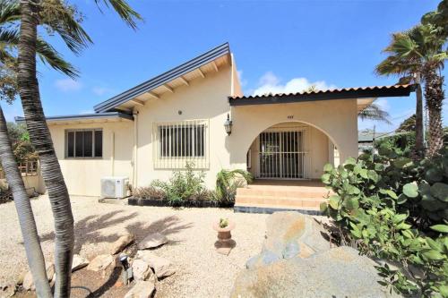 a house with a dog statue in front of it at Paradera Paradise - your ultimate 5-bedroom getaway in Paradera