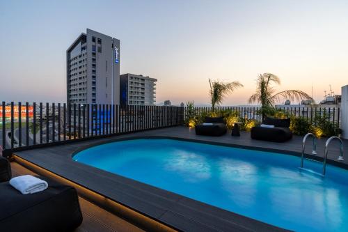 a swimming pool on the roof of a building at The Penthouse - 3BR Seaview with Private Pool in Larnaca in Larnaca