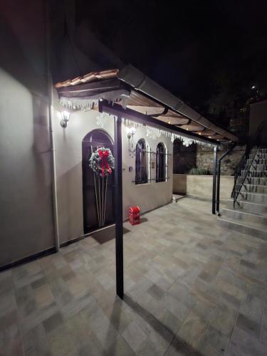 a pavilion with a vase of red flowers on it at Casa Di Munti in Konitsa