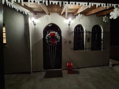 a room with a door with a wreath on it at Casa Di Munti in Konitsa