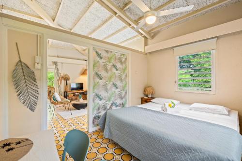 Postel nebo postele na pokoji v ubytování Bungalow Bossa Nova
