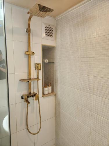 a bathroom with a shower with a shower head at Wooyeon in Seongnam